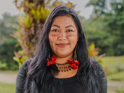 Portrait of Tania Ukuncham with green background scene