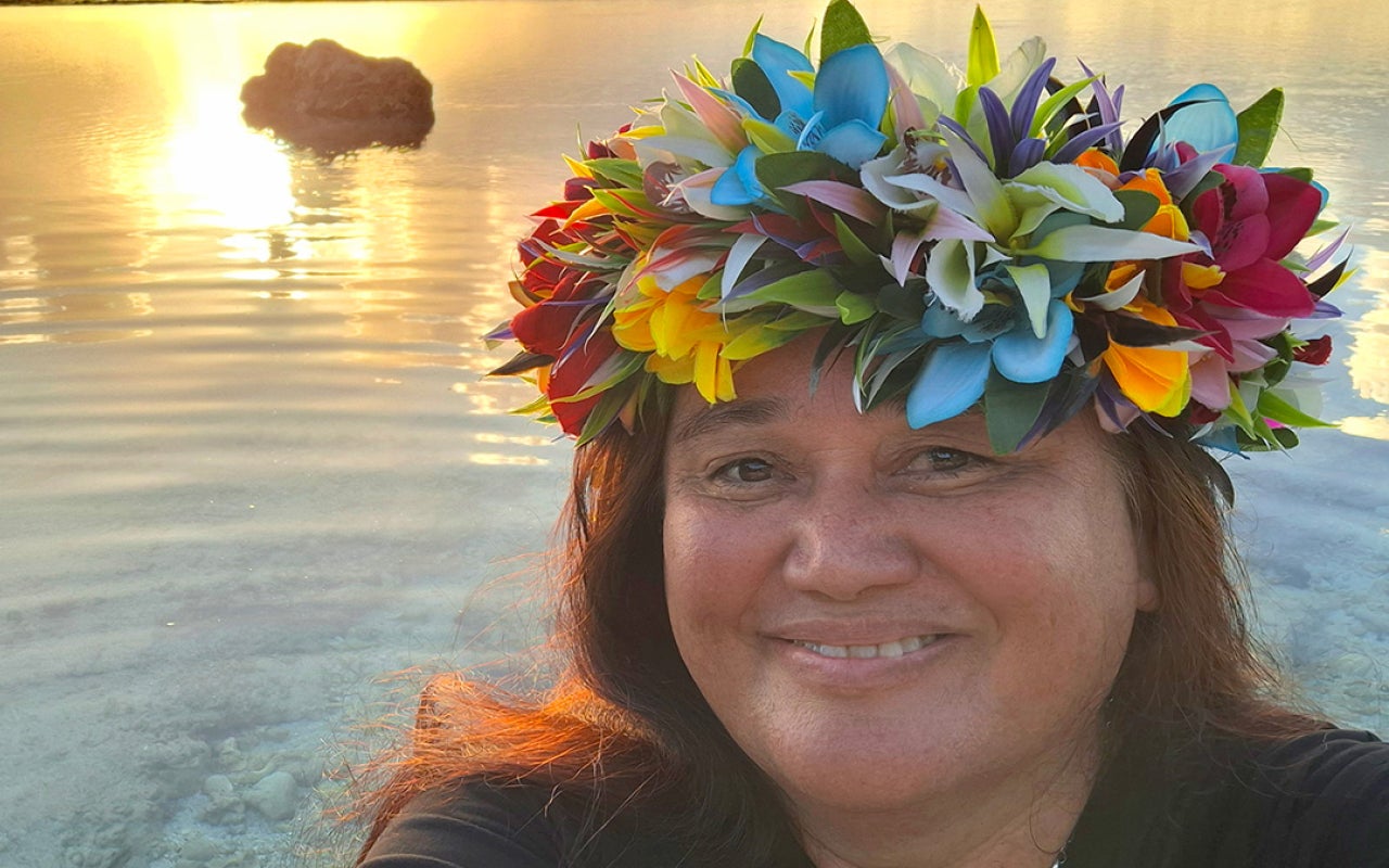 Profile photo of Melina Tuiravakai with sunset in background