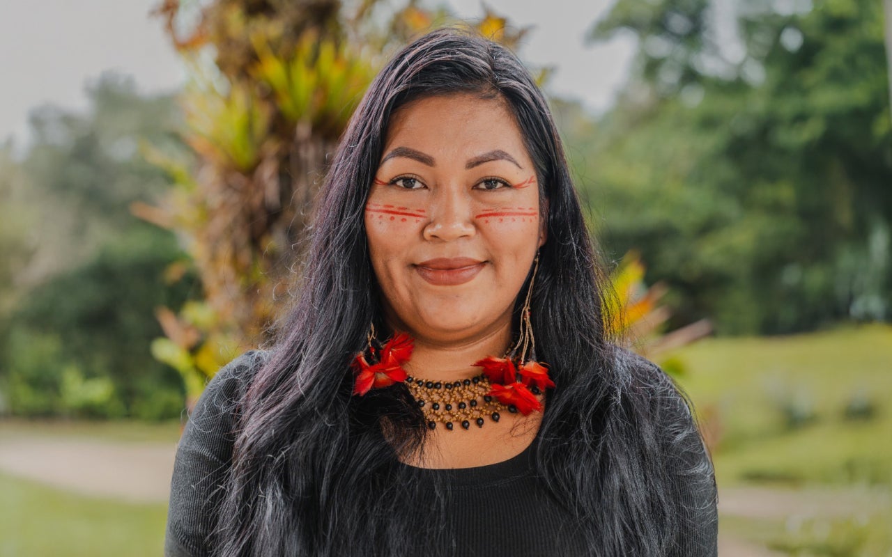 Portrait of Tania Ukuncham with green background scene